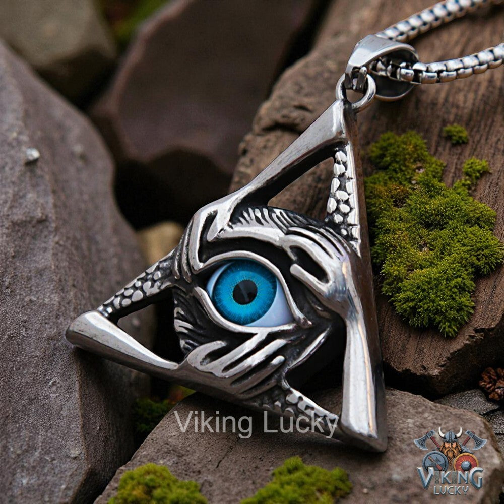 Silver pendant with eye design on a rocky surface, featuring 'Viking Lucky' branding.