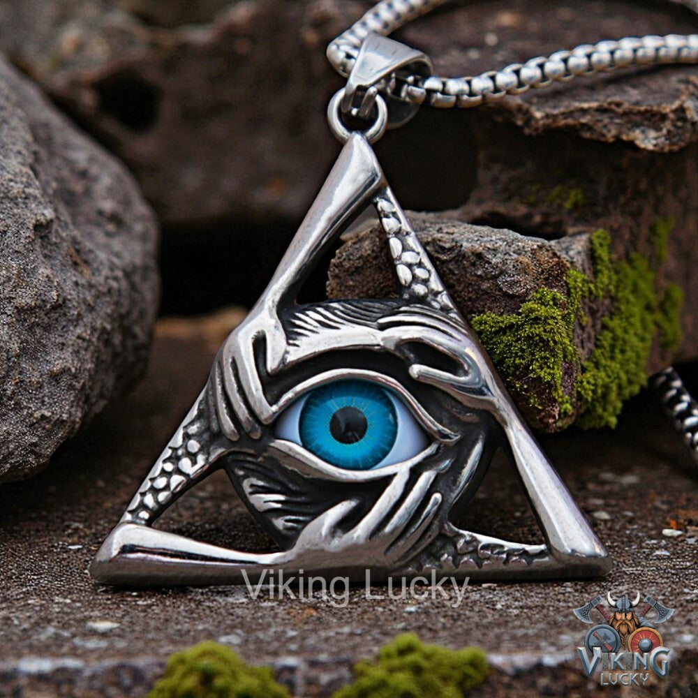 Silver pendant with eye design on a rocky surface, featuring 'Viking Lucky' branding.