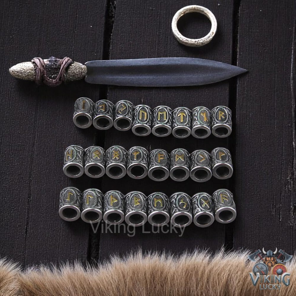 Set of metal rings with runic inscriptions on a dark wooden background, featuring the brand 'Viking Lucky'.