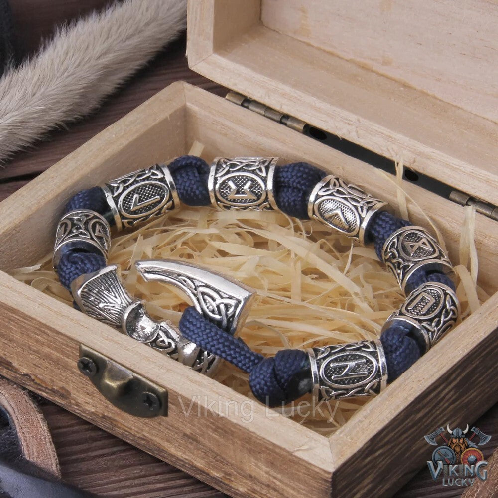 Viking Axe Paracord Bracelet with blue woven cord and silver-tone axe pendant and runic/knotwork beads.