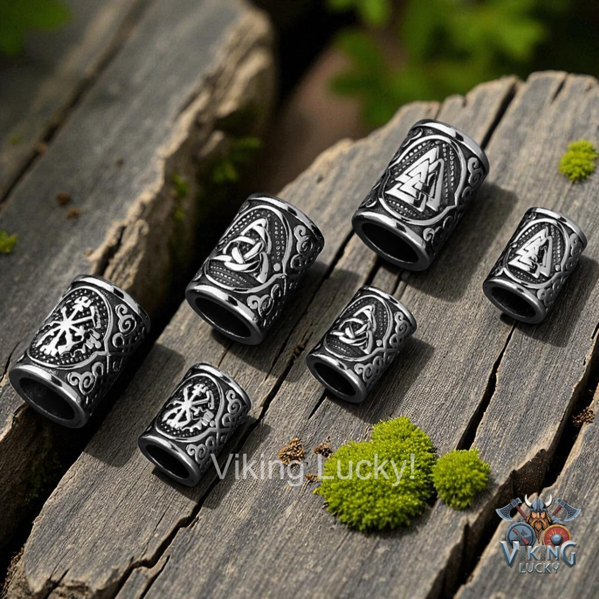 Silver Viking-style rings on a wooden surface with 'Viking Lucky' branding.