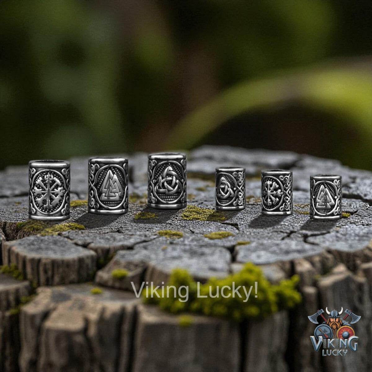 Set of silver rings with Viking designs on a wooden surface, featuring the brand 'Viking Lucky'.
