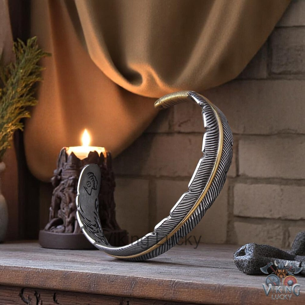 Viking Feather Cuff Bracelet in silver and gold with detailed feather engraving Angled-shot