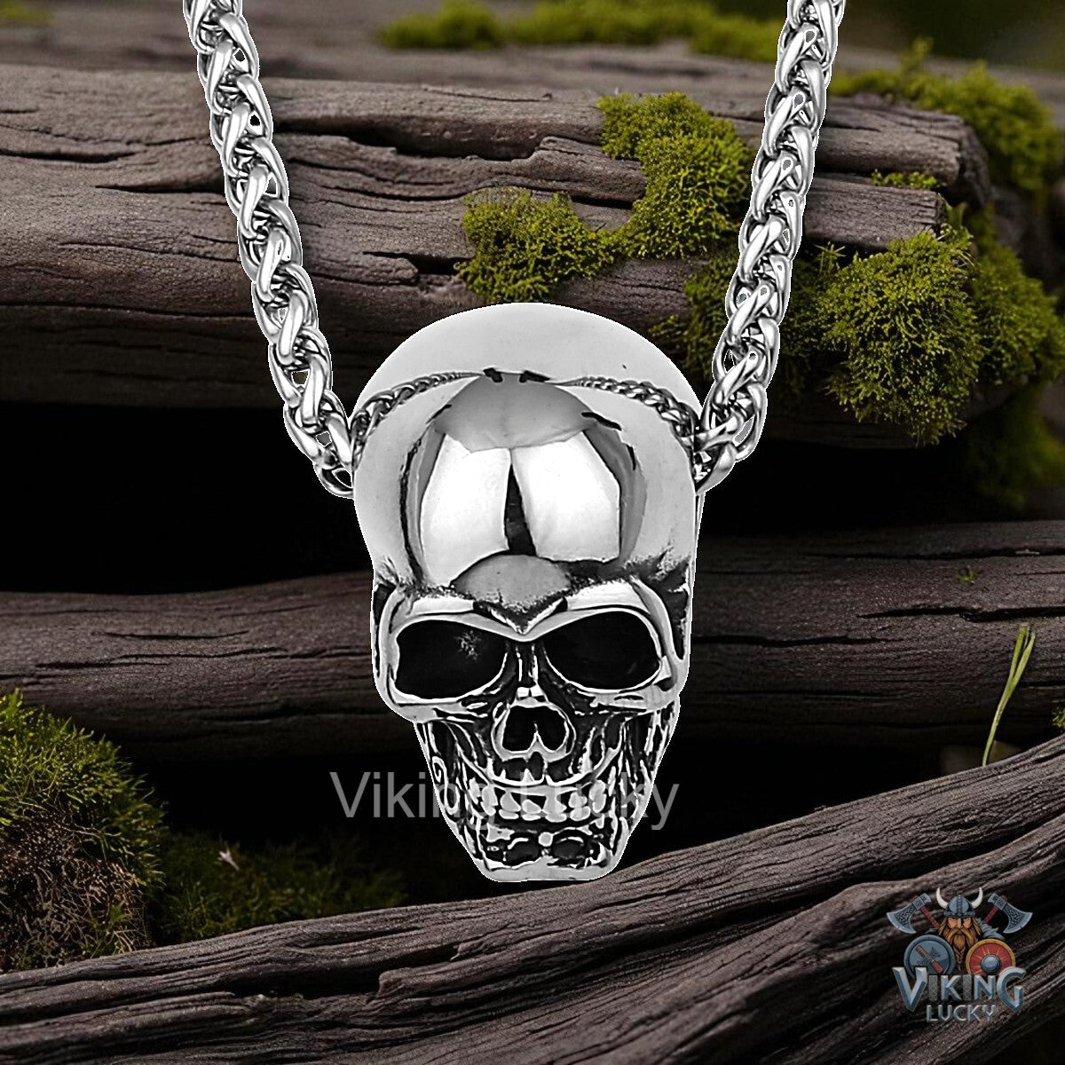 Silver skull pendant necklace on a wooden background