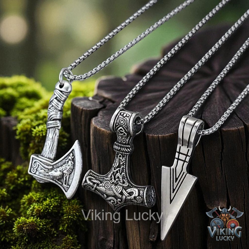 Three silver Viking-style pendants on chains against a natural background with 'Viking Lucky' branding.